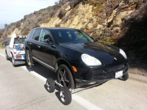 Using dollies on an AWD Porsche SUV prevents damage to the drive train