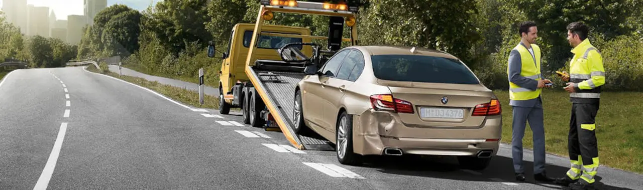 How to get Roadside Service San Diego to provide support? BMW being loaded onto a flatbed
