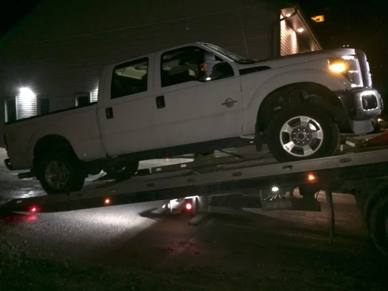 Tow Service San Diego hooks a nice new Ford Powerstroke being winched onto the deck by a Flatbed Tow Truck. We are auto transport, truck transporters, equipment transport, and more.