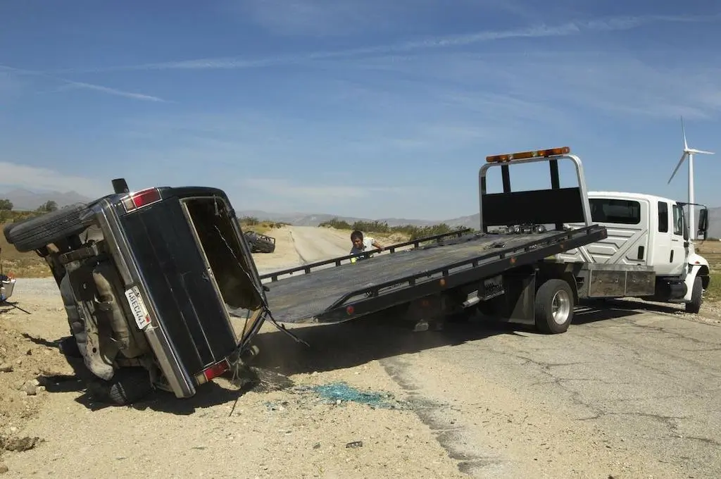 Don't fall victim to this.  Make sure you're towing company is properly permitted, bonded , and insured for the load.  All Roadside Towing carries $3M in liability and $250k for cargo and hook.  