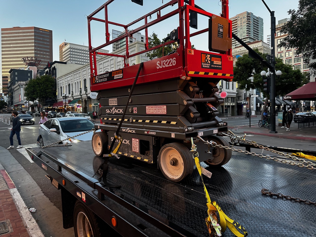 All Roadside Towing moving a very large and heavy scissor lift downtown. We love equipment transport.