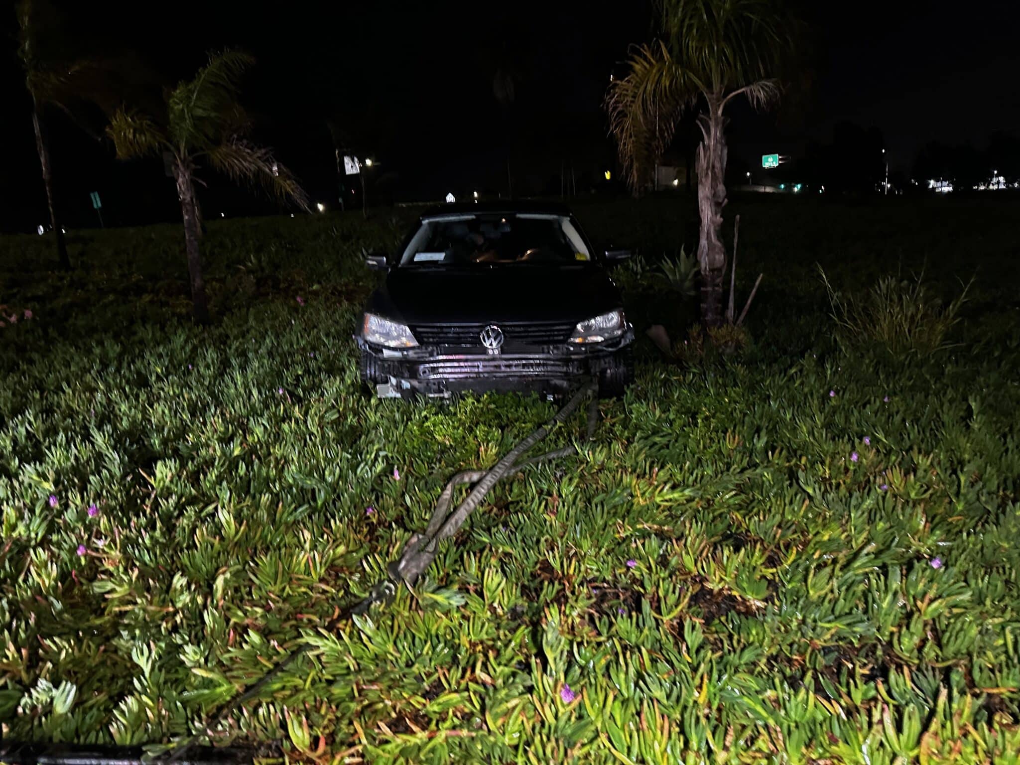 San Diego Tow Company winches a car out of the weeds by the 163 south.  All Roadside Towing working 24/7 to keep you driving.